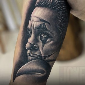 Realistic Joker clown tattoo portrait by Mukesh Waghela at Moksha Tattoo Studio Goa